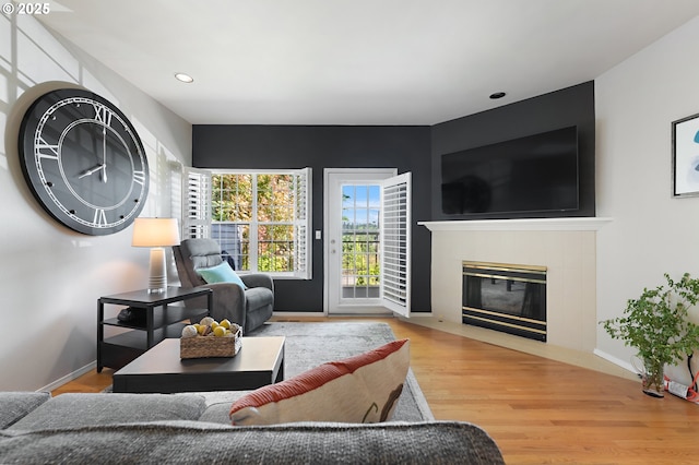 639 1st St, Lake Oswego, OR 97034 - living room with wood finished floors, a tile fireplace, recessed lighting, and baseboards