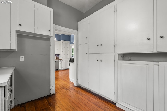 1067 Oak St, Silverton, OR 97381 - kitchen with white cabinetry, wood-type flooring, and light countertops
