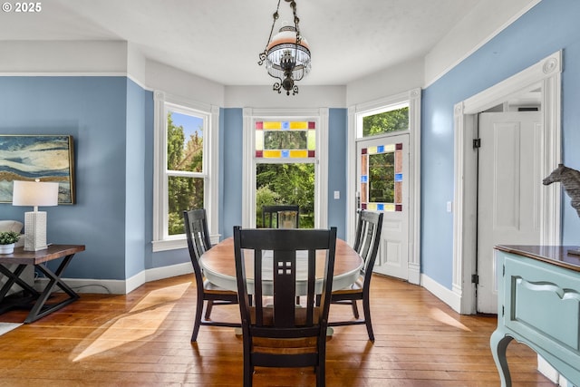 1067 Oak St, Silverton, OR 97381 - dining room with hardwood / wood-style floors, baseboards, and a chandelier