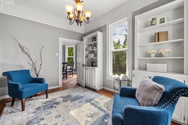 1067 Oak St, Silverton, OR 97381 - sitting room featuring baseboards, a chandelier, and wood finished floors