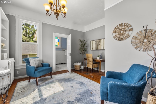 1067 Oak St, Silverton, OR 97381 - sitting room featuring wood finished floors, a chandelier, and baseboards