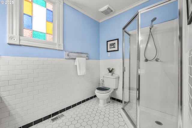 1067 Oak St, Silverton, OR 97381 - bathroom with toilet, a shower stall, crown molding, wainscoting, and tile walls