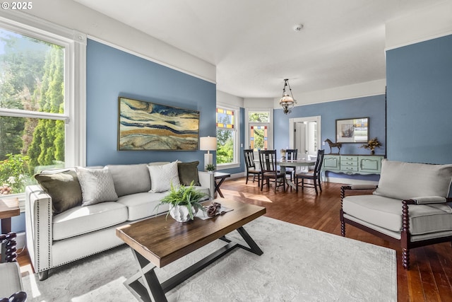 1067 Oak St, Silverton, OR 97381 - living room featuring wood finished floors and a chandelier