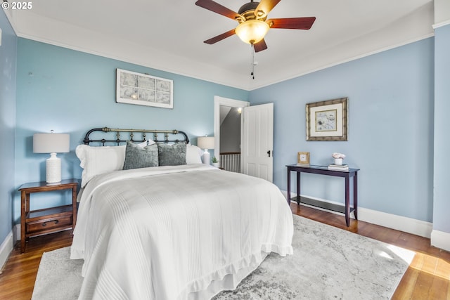 1067 Oak St, Silverton, OR 97381 - bedroom with baseboards, wood finished floors, and a ceiling fan