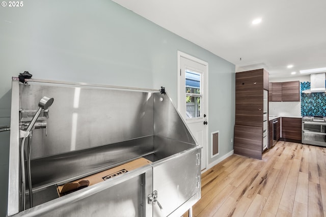 1067 Oak St, Silverton, OR 97381 - misc room with light wood finished floors, baseboards, and recessed lighting
