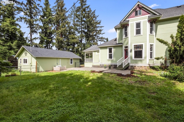 1067 Oak St, Silverton, OR 97381 - back of property with entry steps, a patio, and a shingled roof