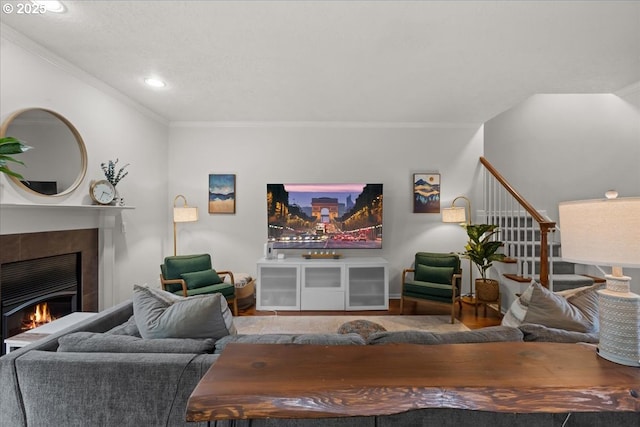 1498 Cathlamet Ct, Salem, OR 97304 - living area featuring a tile fireplace, crown molding, stairs, and recessed lighting