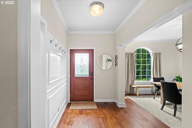 1498 Cathlamet Ct, Salem, OR 97304 - foyer featuring wood-type flooring, crown molding, and baseboards