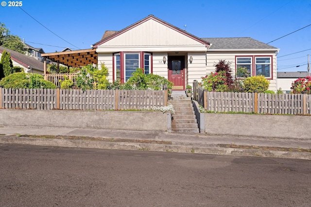 719 6th St, Astoria, OR 97103 - view of front facade featuring a fenced front yard and roof with shingles