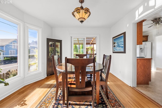 719 6th St, Astoria, OR 97103 - dining room featuring plenty of natural light, light wood-type flooring, and baseboards