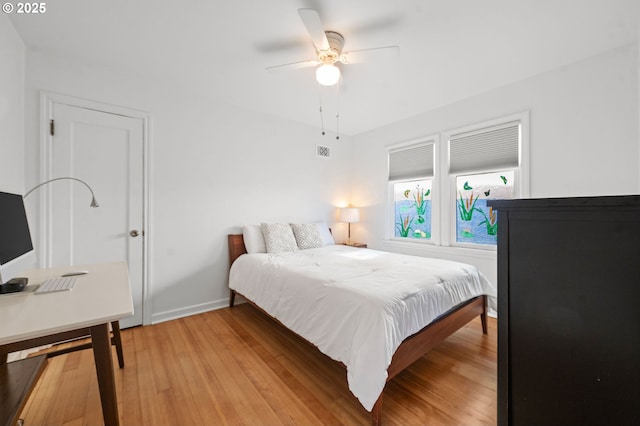 719 6th St, Astoria, OR 97103 - bedroom featuring light wood finished floors, baseboards, and a ceiling fan
