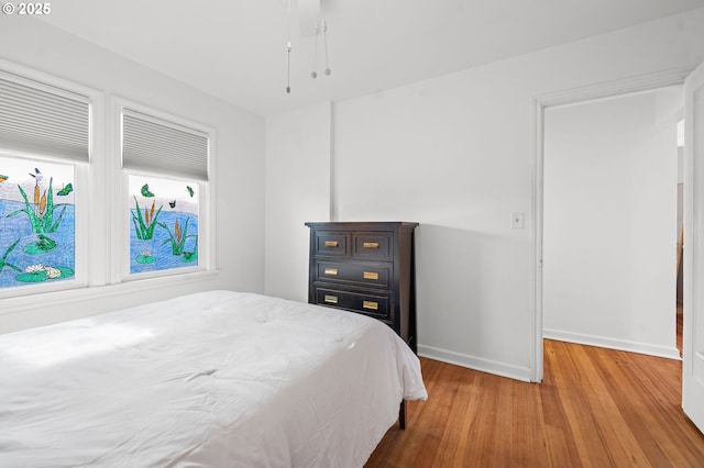 719 6th St, Astoria, OR 97103 - bedroom featuring wood finished floors and baseboards