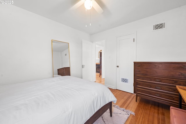 719 6th St, Astoria, OR 97103 - bedroom with light wood-type flooring and a ceiling fan