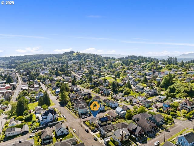 719 6th St, Astoria, OR 97103 - aerial perspective of suburban area with a mountainous background