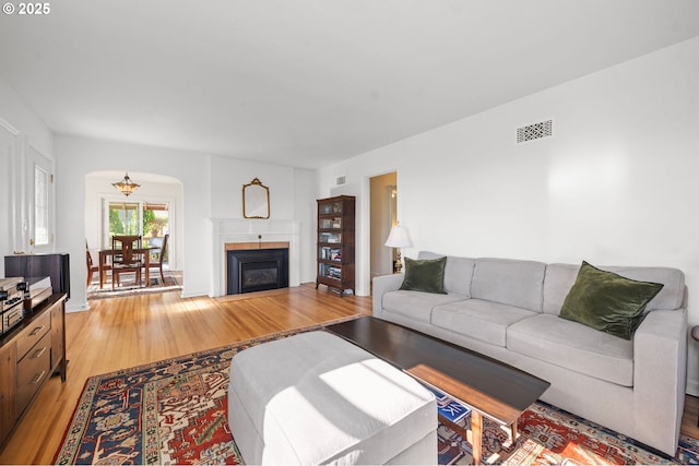 719 6th St, Astoria, OR 97103 - living room with light wood finished floors and a glass covered fireplace