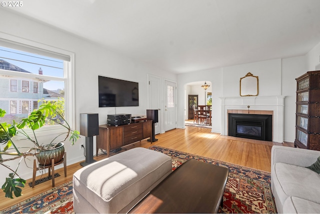 719 6th St, Astoria, OR 97103 - living room with light wood-style floors and arched walkways