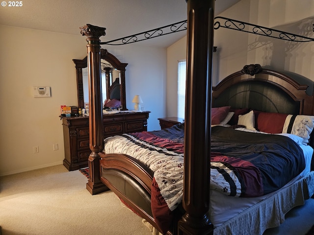 carpeted bedroom with lofted ceiling