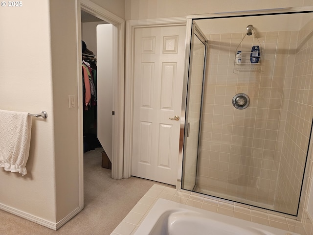 bathroom with a shower with shower door