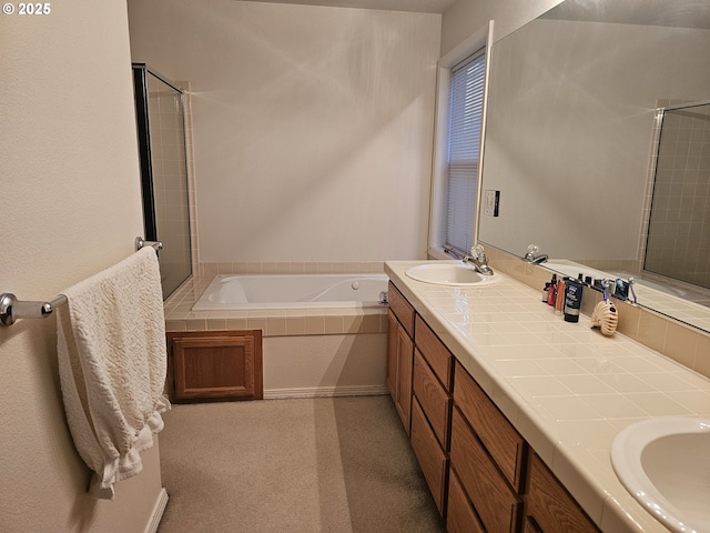 bathroom featuring vanity and a bath