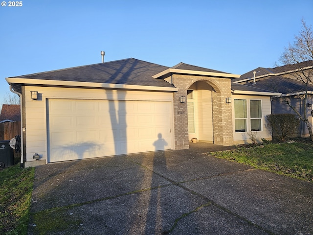 ranch-style home featuring a garage