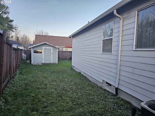 yard at dusk with a storage unit