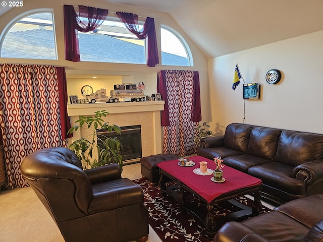 living room with plenty of natural light, a fireplace, high vaulted ceiling, and carpet