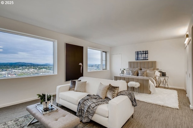 living room featuring carpet flooring and baseboards