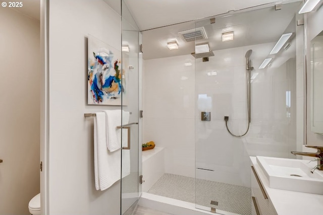 full bath featuring a shower stall, toilet, and vanity