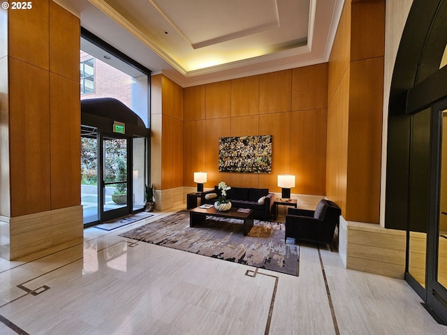 building lobby featuring wooden walls and a towering ceiling