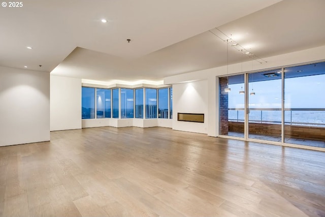 unfurnished living room with wood finished floors