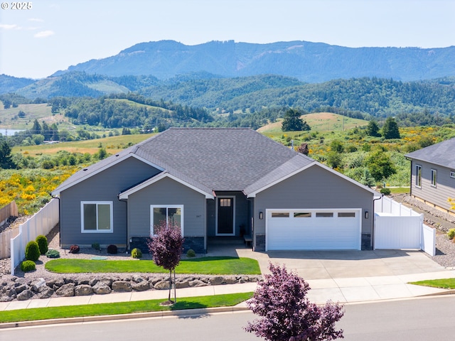 847 Pebble Crk St, Sutherlin, OR 97479 - view of front facade with a mountain view, an attached garage, and concrete driveway