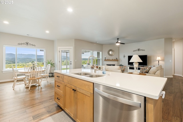 847 Pebble Crk St, Sutherlin, OR 97479 - kitchen featuring stainless steel dishwasher, a sink, a kitchen island with sink, a ceiling fan, and open floor plan