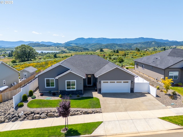 847 Pebble Crk St, Sutherlin, OR 97479 - ranch-style home with a mountain view, a garage, and concrete driveway