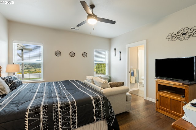 847 Pebble Crk St, Sutherlin, OR 97479 - bedroom featuring multiple windows, dark wood-type flooring, a ceiling fan, and connected bathroom