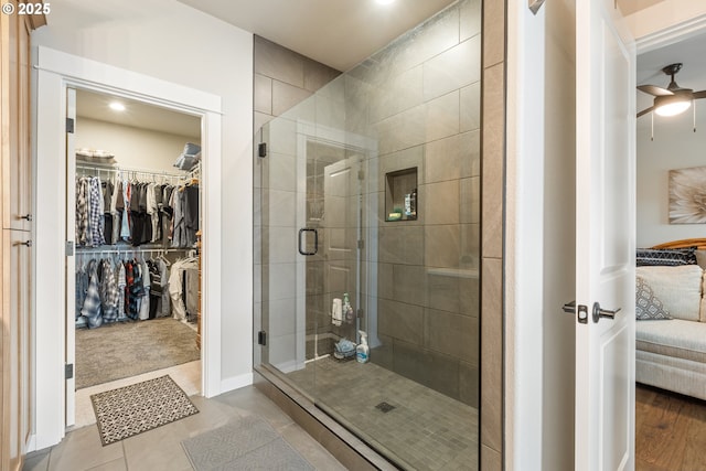 847 Pebble Crk St, Sutherlin, OR 97479 - ensuite bathroom with a shower stall, a spacious closet, and a ceiling fan