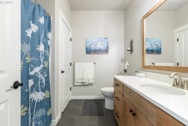847 Pebble Crk St, Sutherlin, OR 97479 - bathroom with vanity, toilet, baseboards, and tile patterned floors