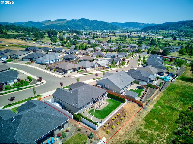 847 Pebble Crk St, Sutherlin, OR 97479 - aerial view of residential area featuring property parcel outlined and mountains
