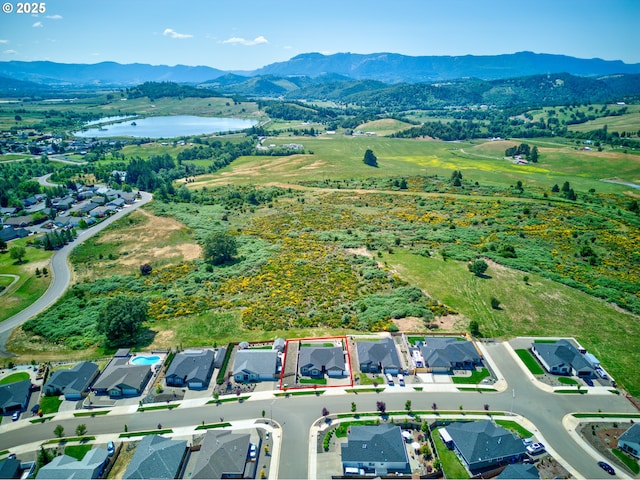 847 Pebble Crk St, Sutherlin, OR 97479 - aerial perspective of suburban area with a water and mountain view and property boundaries highlighted