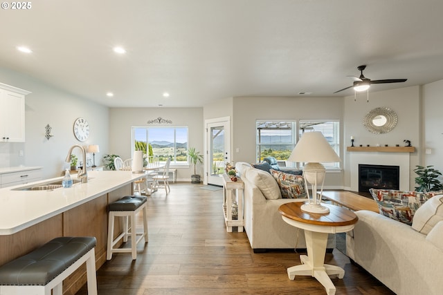 847 Pebble Crk St, Sutherlin, OR 97479 - living area with recessed lighting, dark wood-type flooring, a glass covered fireplace, and ceiling fan