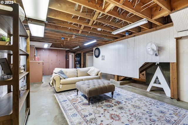 living area with concrete flooring