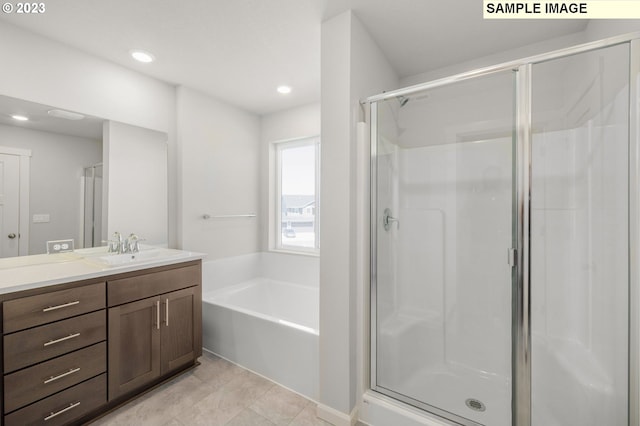 bathroom featuring tile patterned flooring, a garden tub, recessed lighting, vanity, and a stall shower