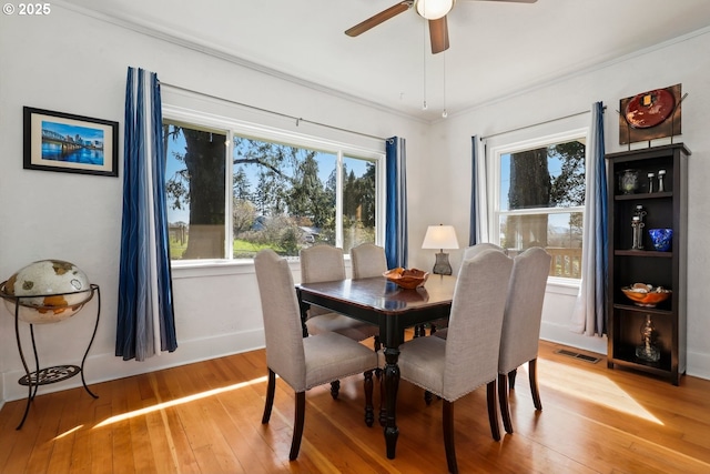 44409 SW Knight Rd, Gaston, OR 97119 - dining room with light wood-style flooring, a ceiling fan, crown molding, and baseboards