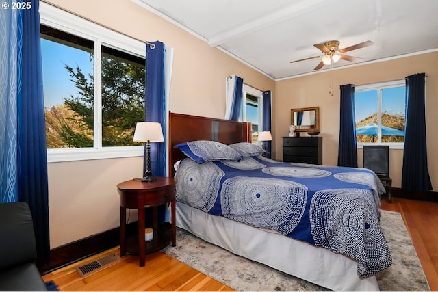 44409 SW Knight Rd, Gaston, OR 97119 - bedroom featuring wood finished floors, multiple windows, and crown molding