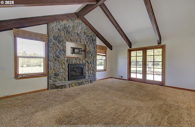 46135 E Avery Rd, Chehalis, WA 98532 - unfurnished living room featuring baseboards, a stone fireplace, lofted ceiling with beams, and carpet