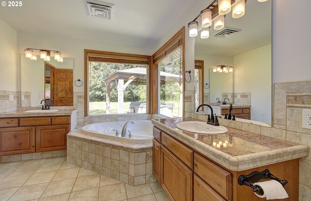 46135 E Avery Rd, Chehalis, WA 98532 - bathroom with visible vents, a sink, tile patterned floors, a garden tub, and two vanities