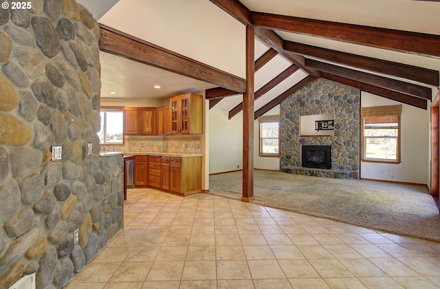 46135 E Avery Rd, Chehalis, WA 98532 - unfurnished living room with recessed lighting, light tile patterned floors, baseboards, a stone fireplace, and vaulted ceiling with beams