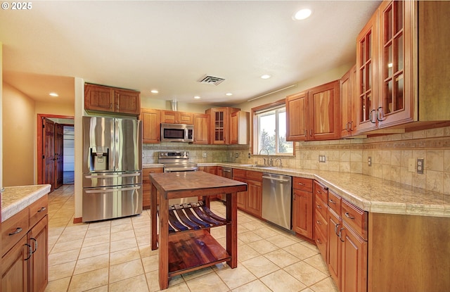 46135 E Avery Rd, Chehalis, WA 98532 - kitchen with a sink, backsplash, visible vents, and appliances with stainless steel finishes