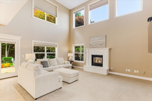 980 SW 7th St, Dundee, OR 97115 - carpeted living room with a high ceiling and a glass covered fireplace