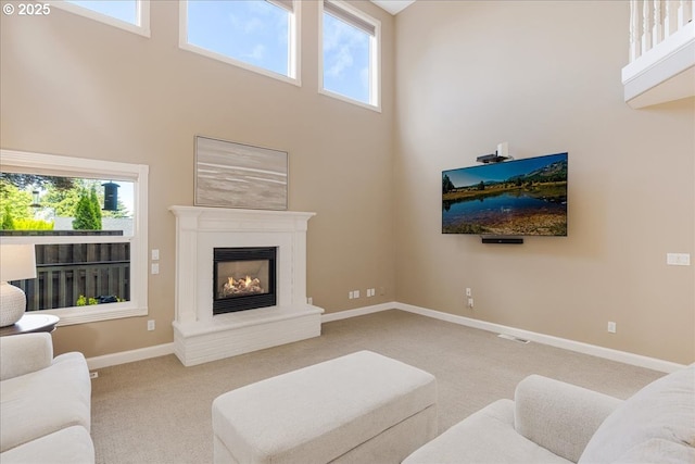 980 SW 7th St, Dundee, OR 97115 - carpeted living room with a towering ceiling and a glass covered fireplace