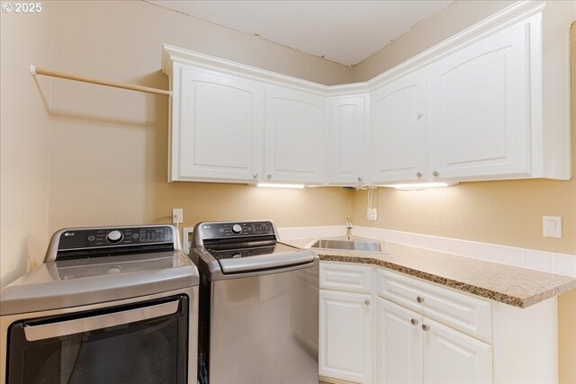 980 SW 7th St, Dundee, OR 97115 - washroom featuring washing machine and dryer and cabinet space
